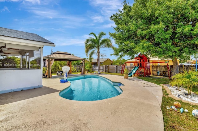 509 SW Hamburg Ter, Port St Lucie, FL 34984 - view of pool with a gazebo, a patio, a fenced backyard, and a playground