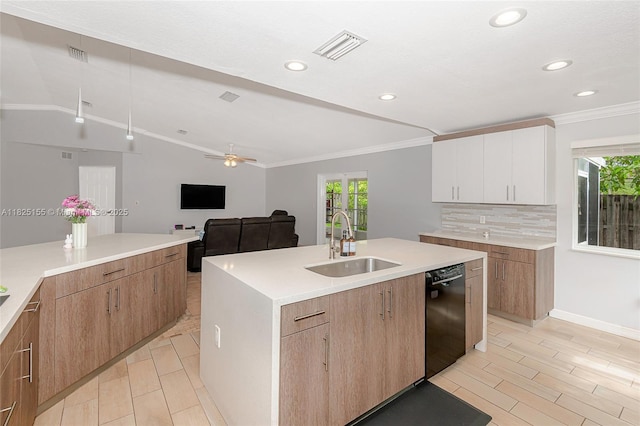 16859 Crestview Ln, Weston, FL 33326 - kitchen with black dishwasher, healthy amount of natural light, ornamental molding, a kitchen island with sink, and backsplash