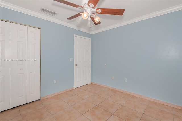16859 Crestview Ln, Weston, FL 33326 - unfurnished bedroom featuring ornamental molding, a closet, light tile patterned floors, and a ceiling fan