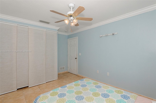 16859 Crestview Ln, Weston, FL 33326 - unfurnished bedroom with ornamental molding, tile patterned floors, and ceiling fan