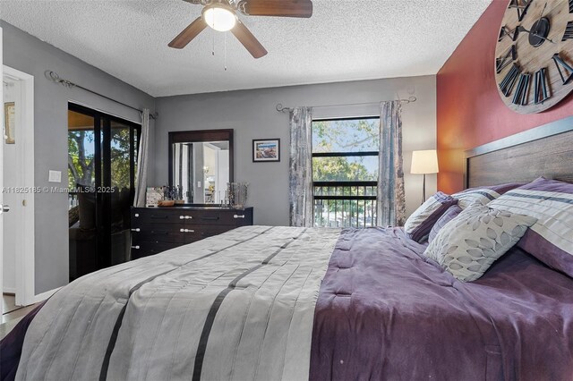 3059 S Carambola Cir S Unit 2330, Coconut Creek, FL 33066 - bedroom featuring multiple windows, a textured ceiling, and ceiling fan