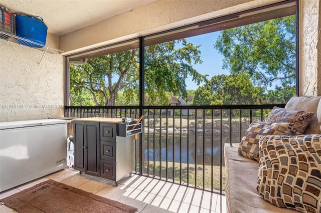3059 S Carambola Cir S Unit 2330, Coconut Creek, FL 33066 - unfurnished sunroom featuring a water view