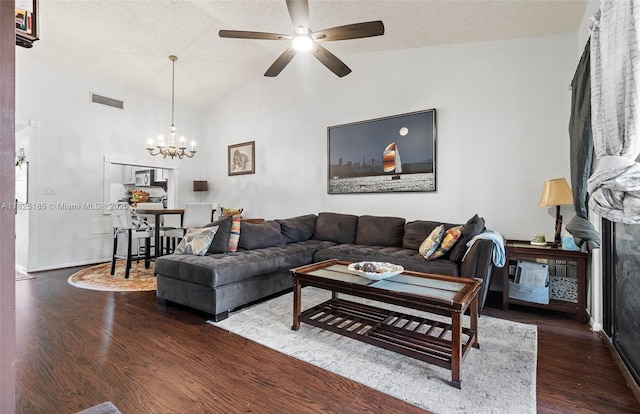 3059 S Carambola Cir S Unit 2330, Coconut Creek, FL 33066 - living room with a chandelier, dark wood-type flooring, ceiling fan, a textured ceiling, and a fireplace