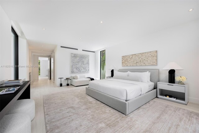 3670 Avocado Ave, Miami, FL 33133 - bedroom featuring multiple windows, wood finished floors, and recessed lighting