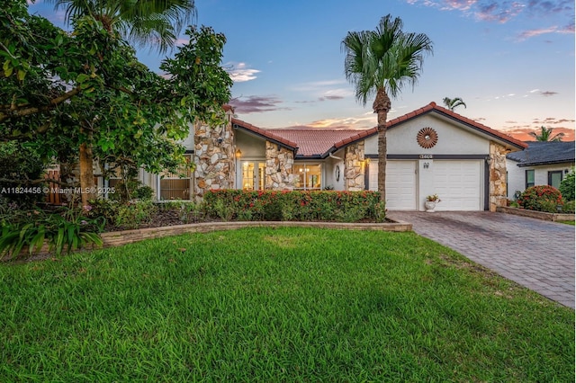 1460 NW 99th Ave, Plantation, FL 33322 - view of front of home featuring stone siding, stucco siding, an attached garage, and decorative driveway