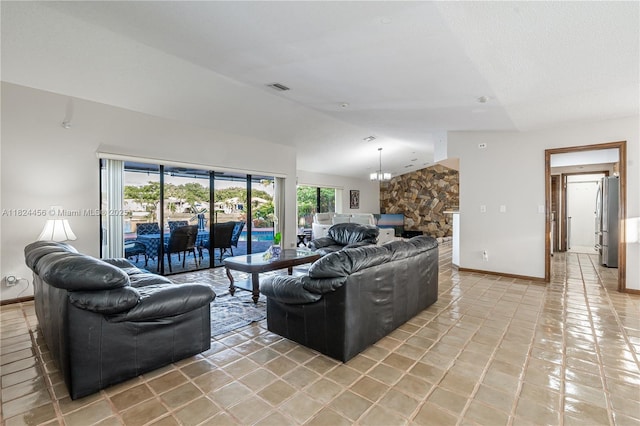 1460 NW 99th Ave, Plantation, FL 33322 - living room with vaulted ceiling, light tile patterned floors, and a chandelier