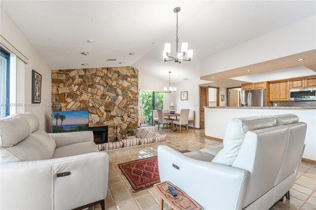 1460 NW 99th Ave, Plantation, FL 33322 - living room featuring a chandelier, lofted ceiling, a stone fireplace, and recessed lighting
