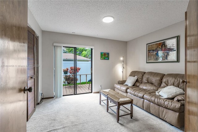 1460 NW 99th Ave, Plantation, FL 33322 - carpeted living area featuring a textured ceiling and baseboards