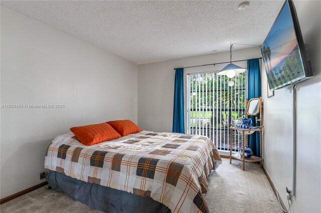 1460 NW 99th Ave, Plantation, FL 33322 - carpeted bedroom featuring a textured ceiling and baseboards