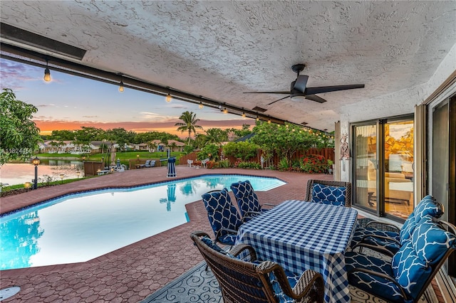 1460 NW 99th Ave, Plantation, FL 33322 - swimming pool featuring a water view, ceiling fan, a patio, and outdoor dining area