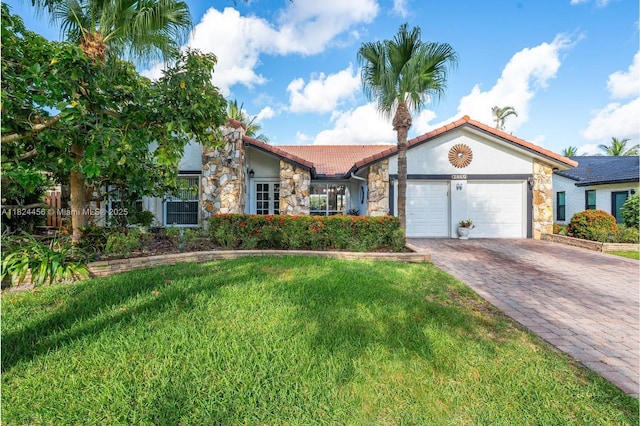 1460 NW 99th Ave, Plantation, FL 33322 - view of front of house with stone siding, an attached garage, a tiled roof, a front lawn, and stucco siding