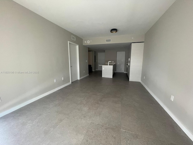 1300 S Miami Ave Unit 2304, Miami, FL 33130 - unfurnished bedroom featuring baseboards and a sink