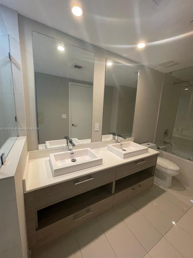 1300 S Miami Ave Unit 2304, Miami, FL 33130 - bathroom with double vanity, tile patterned flooring,  shower combination, and recessed lighting