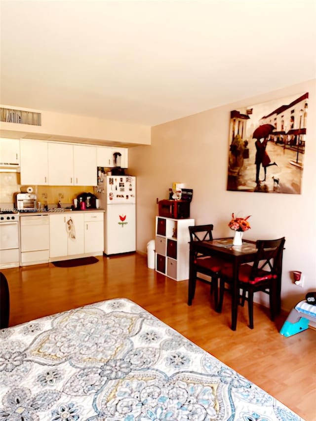 13455 SW 16th Ct Unit 304F, Pembroke Pines, FL 33027 - dining area with light wood-type flooring