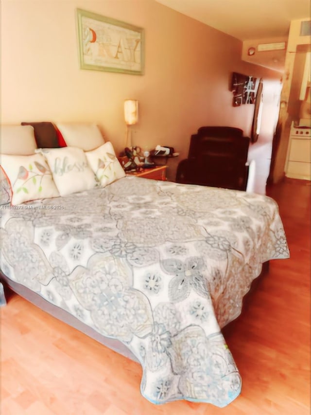 13455 SW 16th Ct Unit 304F, Pembroke Pines, FL 33027 - bedroom with wood finished floors