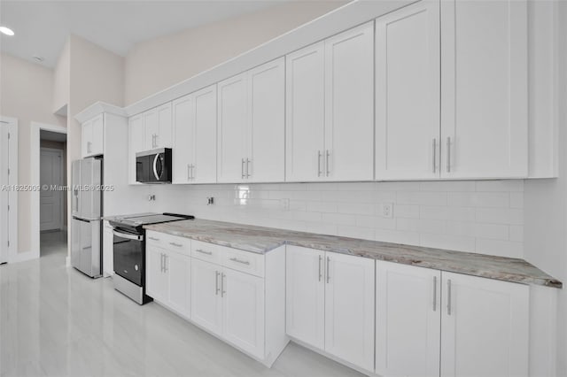 1520 NW 36th Pl, Cape Coral, FL 33993 - kitchen with appliances with stainless steel finishes, decorative backsplash, light stone counters, white cabinets, and recessed lighting