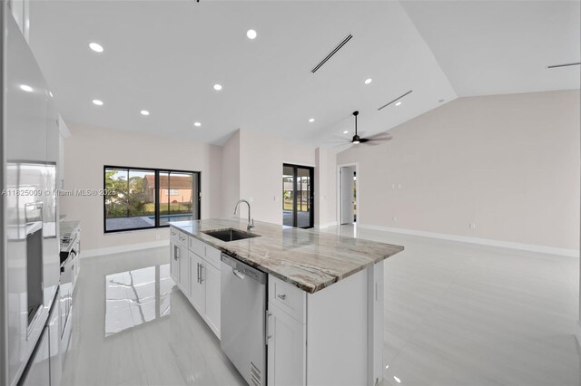 1520 NW 36th Pl, Cape Coral, FL 33993 - kitchen with stainless steel dishwasher, vaulted ceiling, healthy amount of natural light, a center island with sink, and open floor plan