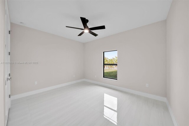 1520 NW 36th Pl, Cape Coral, FL 33993 - empty room featuring a ceiling fan and baseboards