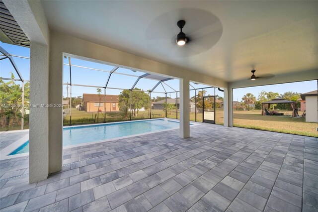 1520 NW 36th Pl, Cape Coral, FL 33993 - outdoor pool with a ceiling fan, a patio, a lawn, and a lanai