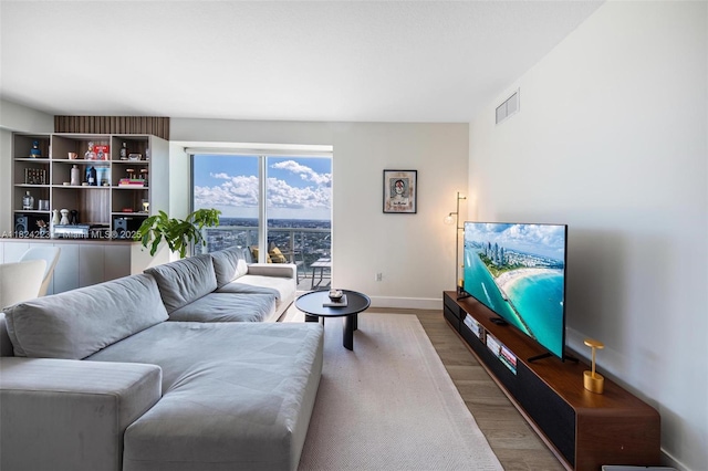 1900 N Bayshore Dr Unit 4111, Miami, FL 33132 - living room featuring wood finished floors and baseboards