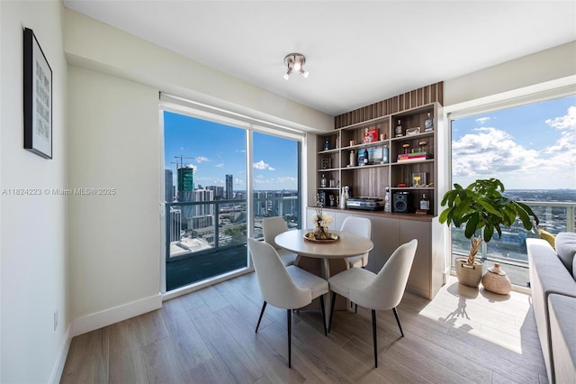 1900 N Bayshore Dr Unit 4111, Miami, FL 33132 - dining room with wood finished floors and a city view