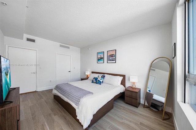 1900 N Bayshore Dr Unit 4111, Miami, FL 33132 - bedroom featuring light wood-style floors and baseboards