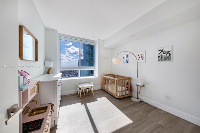 1900 N Bayshore Dr Unit 4111, Miami, FL 33132 - bedroom with wood finished floors and a crib