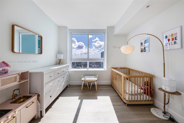 1900 N Bayshore Dr Unit 4111, Miami, FL 33132 - bedroom with wood finished floors and a nursery area