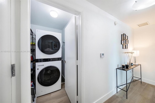 1900 N Bayshore Dr Unit 4111, Miami, FL 33132 - laundry room with stacked washer and clothes dryer and wood finished floors