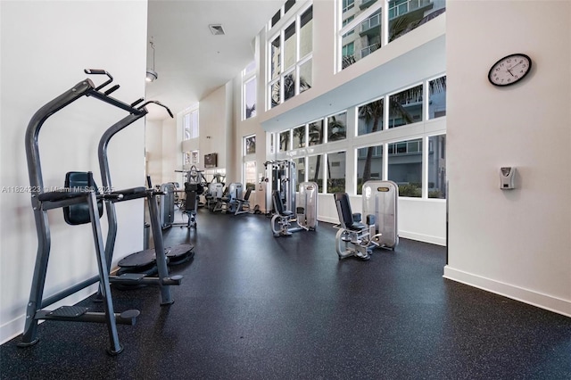 1900 N Bayshore Dr Unit 4111, Miami, FL 33132 - gym featuring baseboards and a high ceiling