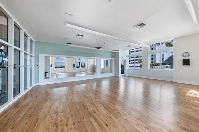1900 N Bayshore Dr Unit 4111, Miami, FL 33132 - unfurnished living room with light wood-style floors and baseboards