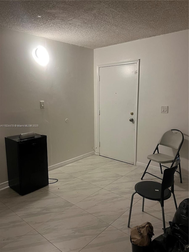 6214 SW 131st Ct Unit 103, Miami, FL 33183 - entryway with light marble finish floors and a textured ceiling