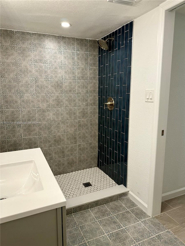 4438 E Riverside Dr, Fort Myers, FL 33905 - full bath featuring a tile shower, vanity, and tile patterned flooring