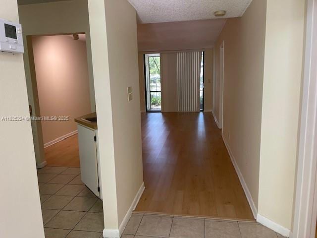 1224 S Military Trl Unit 2312, Deerfield Beach, FL 33442 - corridor featuring light wood finished floors and baseboards