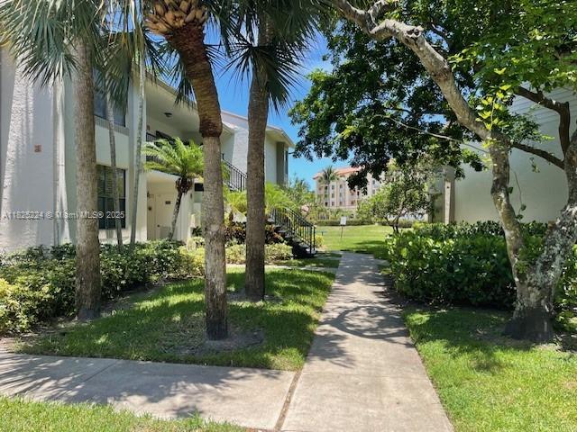 1224 S Military Trl Unit 2312, Deerfield Beach, FL 33442 - view of property's community featuring stairs and a yard