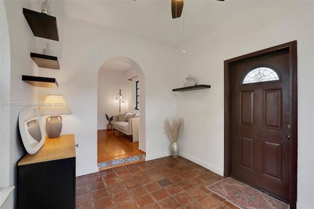 425 Cadagua Ave, Coral Gables, FL 33146 - entrance foyer with arched walkways and a ceiling fan