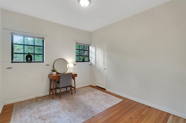 425 Cadagua Ave, Coral Gables, FL 33146 - unfurnished room featuring wood finished floors and an office area