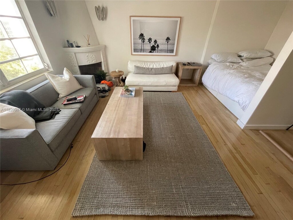 750 Espanola Way Unit 4, Miami Beach, FL 33139 - living room with wood finished floors and a fireplace