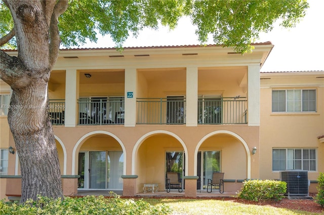 2406 Centergate Dr Unit 202, Miramar, FL 33025 - rear view of house with a balcony and stucco siding