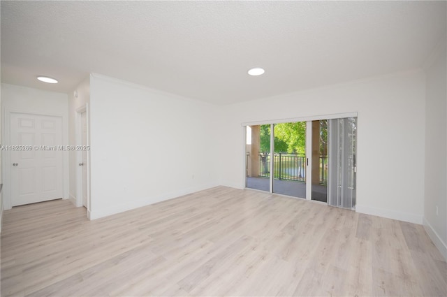 2406 Centergate Dr Unit 202, Miramar, FL 33025 - empty room with light wood-type flooring, ornamental molding, and recessed lighting