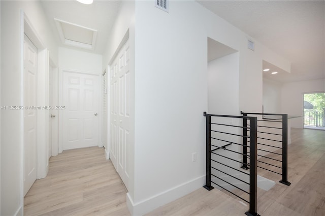 2406 Centergate Dr Unit 202, Miramar, FL 33025 - hallway with an upstairs landing and light wood-style flooring