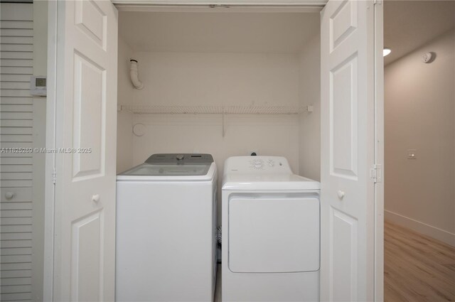 2406 Centergate Dr Unit 202, Miramar, FL 33025 - laundry room with separate washer and dryer and wood finished floors