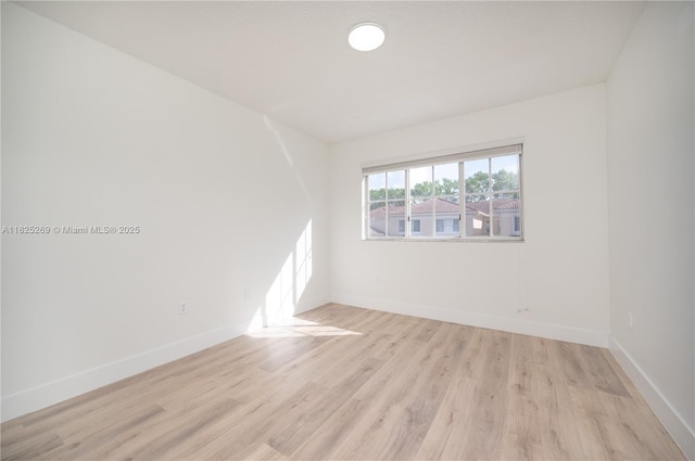 2406 Centergate Dr Unit 202, Miramar, FL 33025 - unfurnished room with light wood-style flooring and baseboards