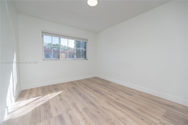 2406 Centergate Dr Unit 202, Miramar, FL 33025 - unfurnished room featuring baseboards and light wood finished floors