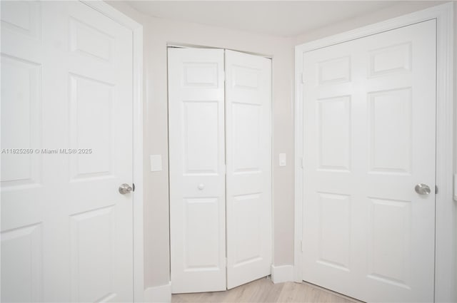 2406 Centergate Dr Unit 202, Miramar, FL 33025 - unfurnished bedroom featuring a closet and light wood finished floors