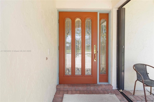 134 E Palm Dr, Margate, FL 33063 - doorway to property featuring stucco siding