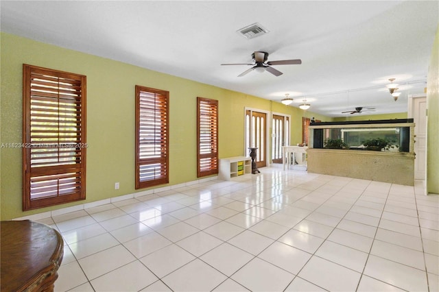 134 E Palm Dr, Margate, FL 33063 - unfurnished living room featuring a ceiling fan, light tile patterned floors, and french doors