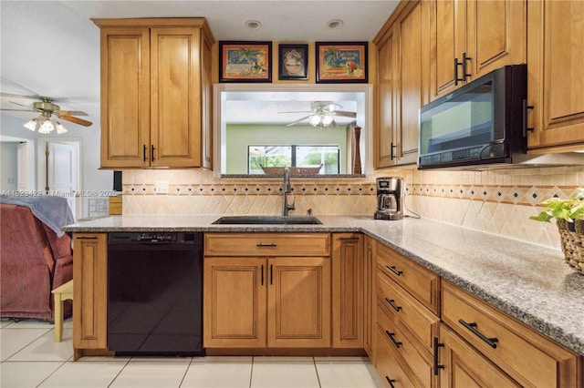134 E Palm Dr, Margate, FL 33063 - kitchen with black appliances, a ceiling fan, brown cabinets, and decorative backsplash