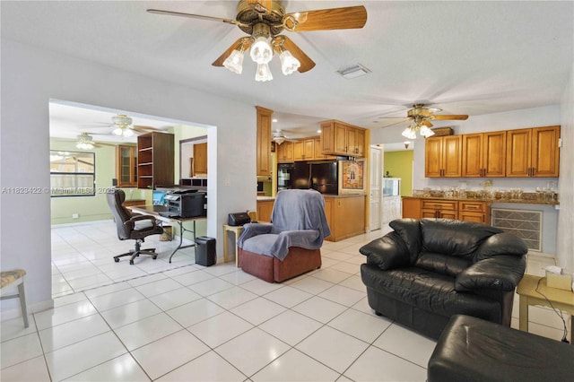 134 E Palm Dr, Margate, FL 33063 - living room with a ceiling fan and light tile patterned floors