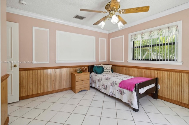 134 E Palm Dr, Margate, FL 33063 - bedroom with a wainscoted wall, ornamental molding, ceiling fan, wood walls, and a textured ceiling